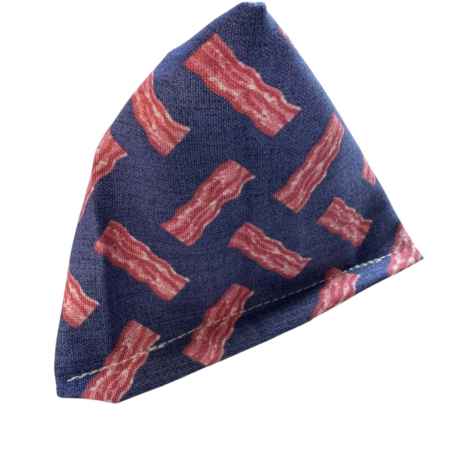 A triangular dark blue Happy Sack catnip toy with an all-over bacon print, ideal for cats to enjoy hours of fun batting and pouncing made by CatnipTakeout.