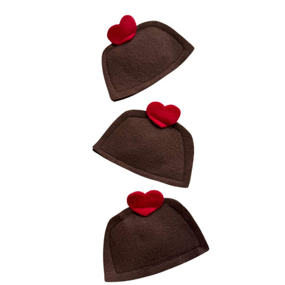 Trio of chocolate bon bon felt catnip toys topped with red hearts, ideal for cats to pounce and cuddle on Valentine's Day made by CatnipTakeout.