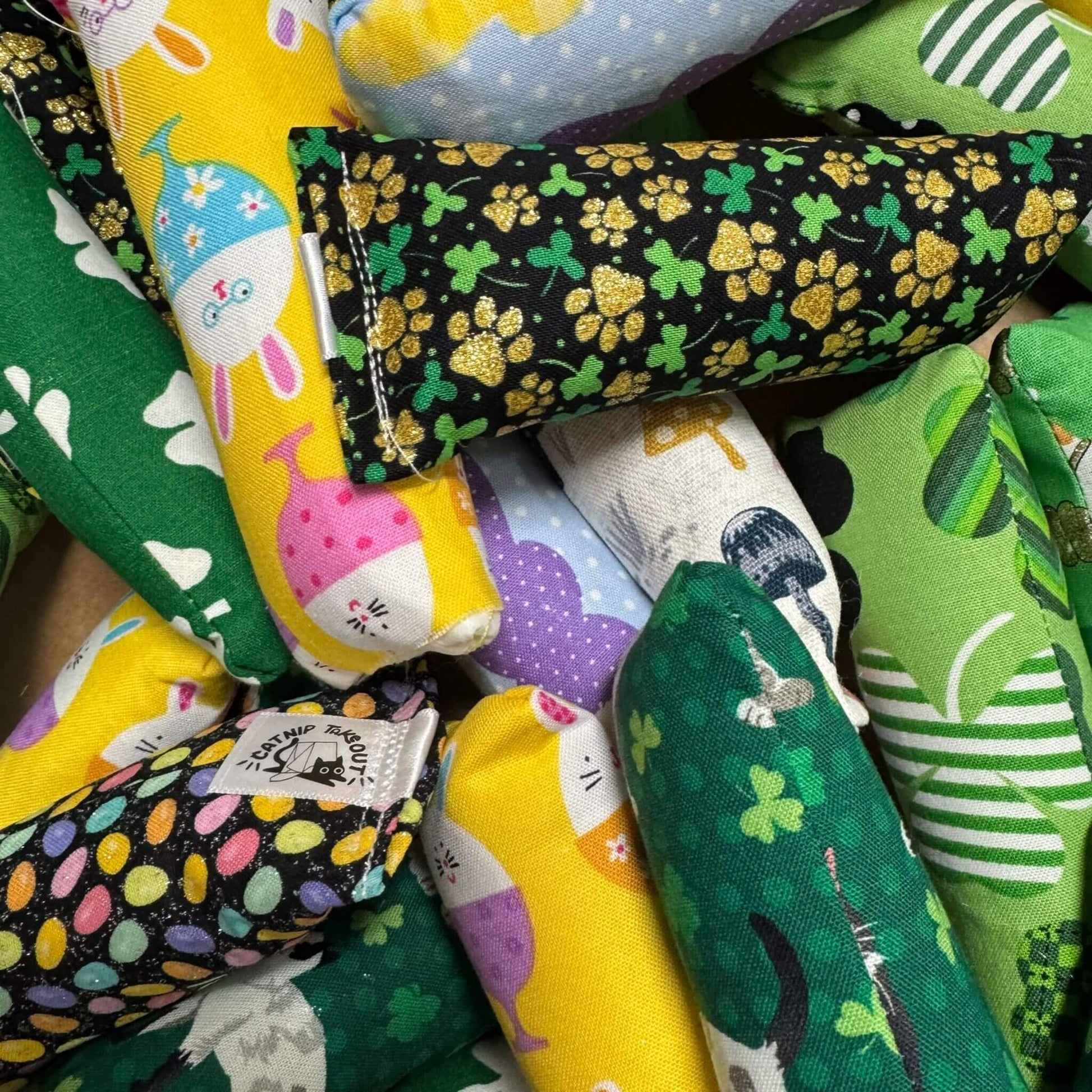 Mini Kicker Cat Toys in St. Patrick’s Day and Easter prints, featuring shamrocks, bunnies, and festive designs. Packed with crinkle and our signature fresh, aromatic premium catnip. Perfect for small paws and big kicks! Made by CatnipTakeout.