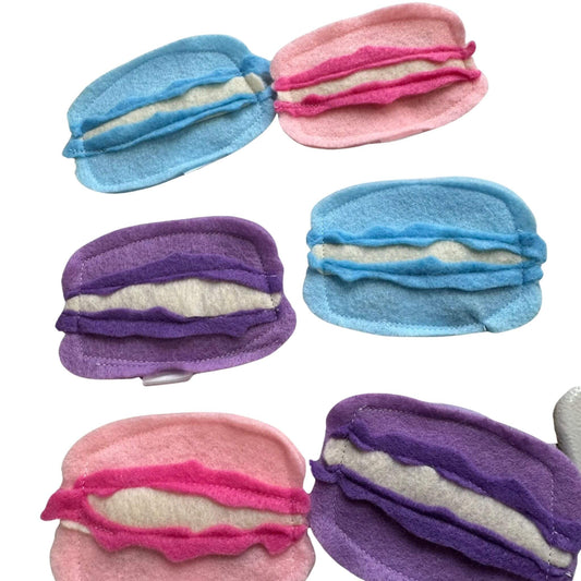 Assorted macaron catnip toys in pink, blue, and lavender  cat toys made by CatnipTakeout.