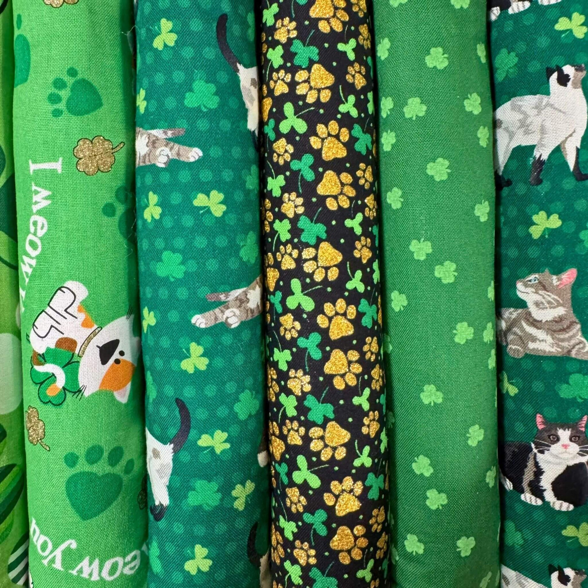 Collection of St. Patrick’s Day-themed kicker cat toys with various lucky prints, including shamrocks, paw prints, and festive cats. Handmade and filled with our signature fresh, aromatic premium catnip. Made by CatnipTakeout.