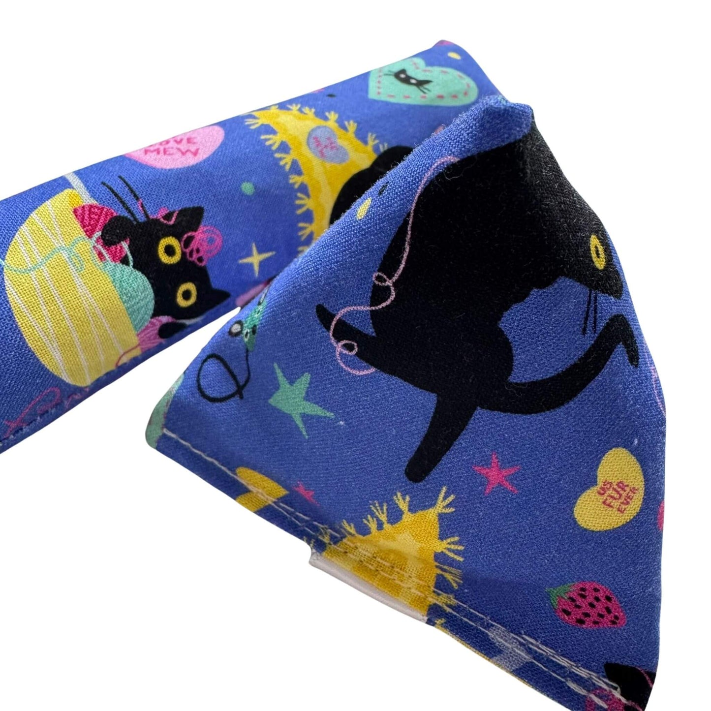 A blue Valentine’s catnip kicker toy and happy sack cat toy featuring black cats with hearts, yarn, and festive elements, perfect for playful cats made by CatnipTakeout.