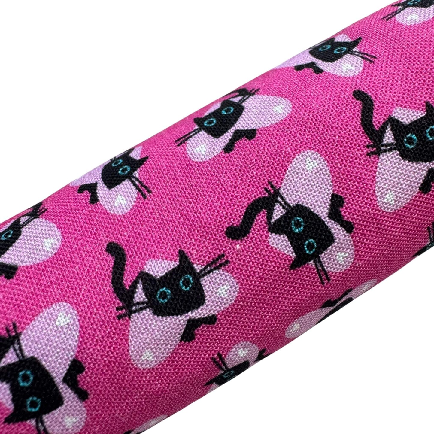 A pink Valentine’s catnip kicker toy featuring black cats with heart-themed details, ideal for pouncing and kicking made by CatnipTakeout.