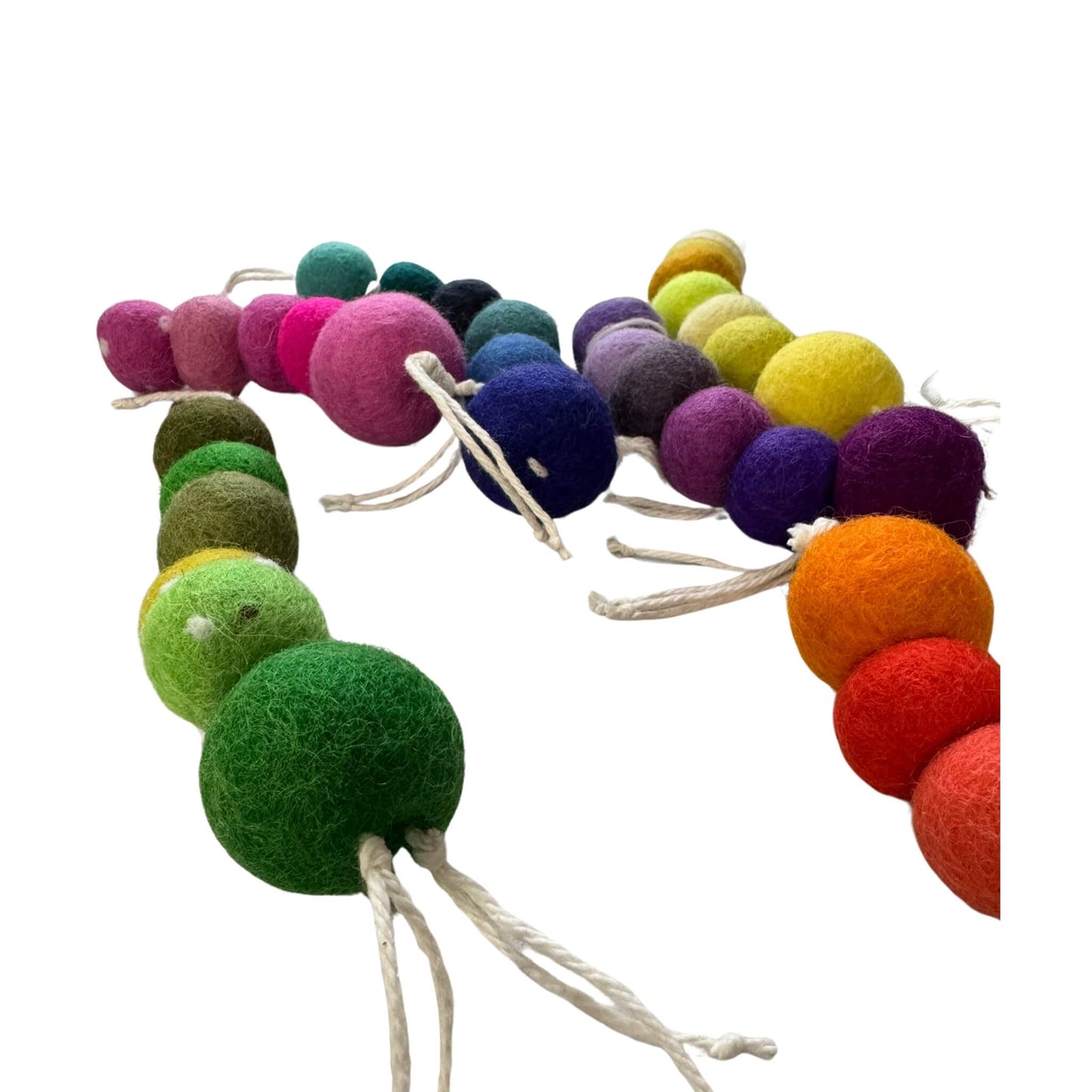 Group of wool worm cat toys displayed in a variety of colors and tones. Each piece is one-of-a-kind, made from soft wool, and sprayed with our signature fresh, aromatic premium catnip. Made by CatnipTakeout